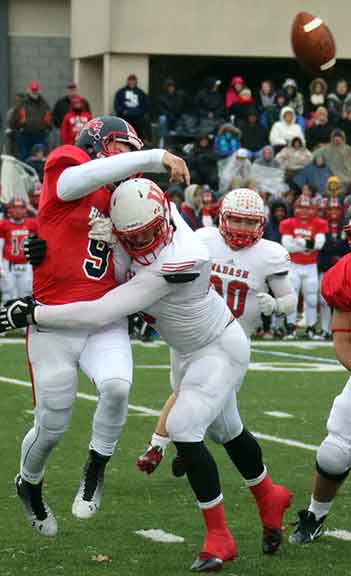 McCullen with pressure on the quarterback.