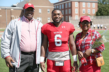 WebberHunt with his parents on Senior Day