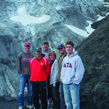 Ty &rsquo;10 (left), Grant &rsquo;16 (second from left), and Kevin &rsquo;81 Benefiel pose at Exit Glacier in Kenai Fjords National Park in Alaska.