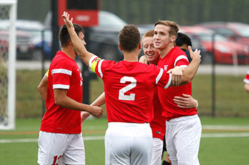 Dorsuleski, middle, celebrates with his teammates