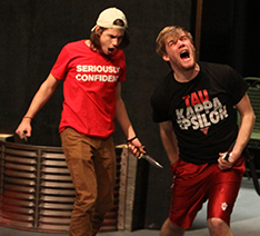 Zach Canon slashes at Noah Eppler during rehearsal for Macbeth.