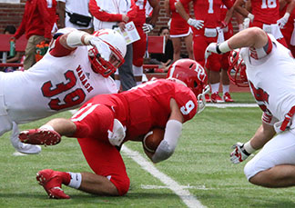 Cody Buresh slows down the Big Red quarterback.