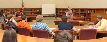 Archivist Beth Swift teaches the students about accessing historical documents