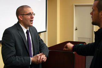 Tanney chatting with a student after his Tuesday night talk.