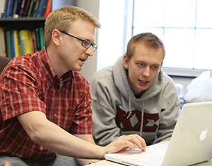 Professor Chad Westphal collaborates with a student.