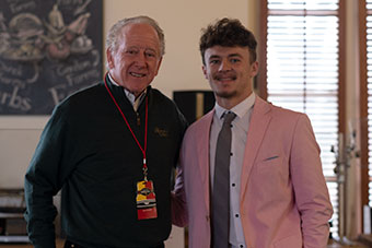 Two great quarterbacks share a pregame moment: Hall of Famer Archie Manning (left) and Liam Thompson.