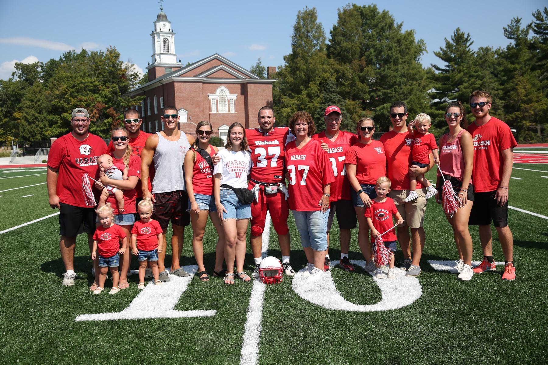 Seth Buresh (center) celebrates Senior Day at the Homecoming game with his family. 