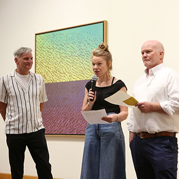 On Friday, September 12, a “MAJOR” exhibit opens in Wabash College’s Erin Dean Gallery, located in the Fine Arts Center on the east side of campus. The exhibit kicks off with an opening reception from 4-7 p.m. with an artist talk at 4:15.  Mark Brosmer and Ryan Lane were among the first students to graduate from Wabash, in 1985, with an art major. Over the past forty years, both artists have cultivated distinct approaches to painting. In this two-person exhibition, fittingly titled “MAJOR,” their work explores the complexity of the everyday, the unseen, and the sublime. Brosmer is a contemporary realist painter with a surrealist edge. His unique vision, subject matter, and technical prowess with a brush is unmistakable, with a signature style that is always evolving. The LA Times covering his show at the Brand Library said it was “big, bold, and surreal in an orderly way.”  Ryan Lane is a professional furnituremaker and painter. He has exhibited his furniture and paintings as a solo artist and in group shows in galleries across the country. In addition to his painting, he continues to be heavily involved in the woodworking industry working as a representative for Indiana Architectural Plywood, one of the preeminent custom veneer houses in the country. In this exhibition, Brosmer and Lane invite you into a world where reality is not so easily defined. Their paintings challenge us to see what is normally overlooked, to question what is placed before us, and to embrace the playfulness and depth that lie hidden within the simplest of things.  Opening that same evening is “20th Century Indiana Art: A Private Collection of Midwestern Regional Paintings,” which features works from the collection of Dan Kraft, a 1985 Wabash graduate. During the late 19th century and early 20th century, American artist moved away from European style influences. Multiple art colonies aided the development and appreciation for this new and unique American art form. Two Indiana-based groups of artists, the Hoosier Group and the Brown County Art Colony, played an important role in the Midwestern version of American Impressionism. The Hoosier Group artists mainly received their academic training in Europe, returning to Indiana and dominating Indiana art through the 1920s. The Brown County Art Colony, a generation of artists homegrown or attracted to the alluring hills and folk of Brown County, heavily influenced Indiana art through the 1950s.  “20th Century Indiana Art: A Private Collection of Midwestern Regional Paintings” provides the viewer with fine examples of some of the leading artists of these two groups of Indiana artists of the 20th century. These works are on loan from the private collection of Dan Kraft '85. “MAJOR” runs from September 12 through November 14. The Eric Dean Gallery is open Monday - Friday 9-5p.m. and Saturday 2-6 p.m. Admission is free and open to the public.