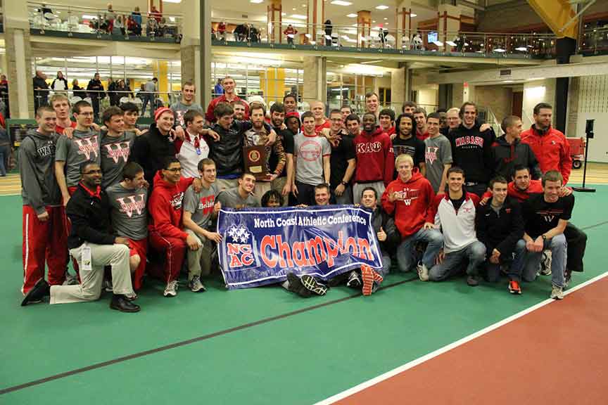 The Wabash track and field team celebrates its 2013 NCAC Men's Indoor title.