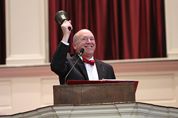 President Gregory Hess rings in the Class of 2022.