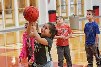 Students work on basketball skills at Chadwick Court