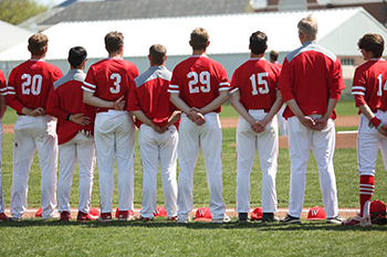 Cochran, No. 29, stands with his teammates for the National Anthem