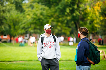 Students have a conversation on the Mall