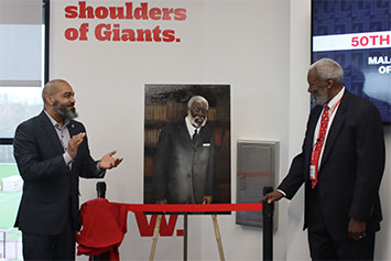 The unveiling of the portrait of Robert Wedgeworth, Jr., painted by Jay Parnell, which will hang in the library in the MXIBS to honor Dr. Wedgeworth's distinguished career in library science. 