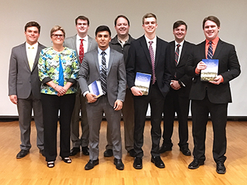 The four finalists with the judges and emcee Kasimir Koehring '18.