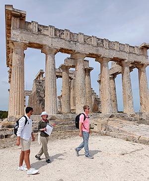 Dr. Wickkiser (center) with students at the Temple of Aphaia, Aegina.