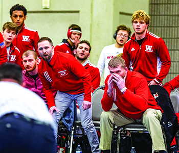 Head Coach Brian Anderson (seated, right) - photo by Jimmy Naprstek