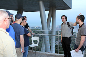 Dr. Moshe Lavee (speaking, center) and Tim Alexander (right) chat with students,