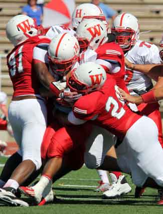 Freshman Stephan Jones (No. 24) in on the gang tackle.