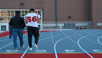 Student-athletes put on Wabash jerseys and posed for pictures at Little Giant Stadium.