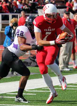 Laird tears the ball away from the Kenyon defender.