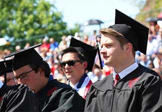 Seniors waiting to go onstage to receive their diplomas