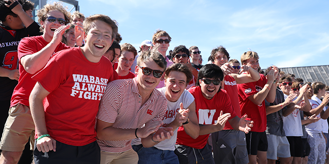 a group of people in red shirts