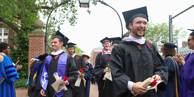 a group of people in graduation gowns