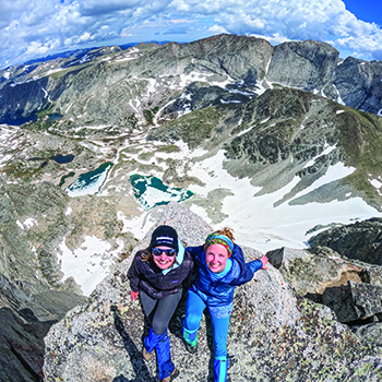 Lucy Schroeder and Isabel Arnold on the summit of East Temple Peak, Wind River Range, Wyoming.