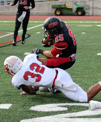 Denzel Wilkins with hit behind the line.