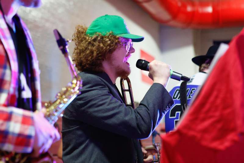 a man singing into a microphone