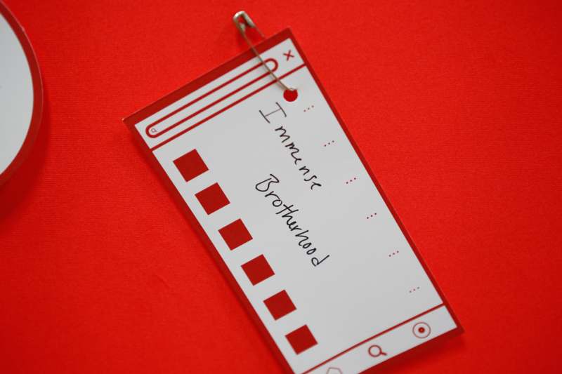 a paper tag with a paper clip attached to it