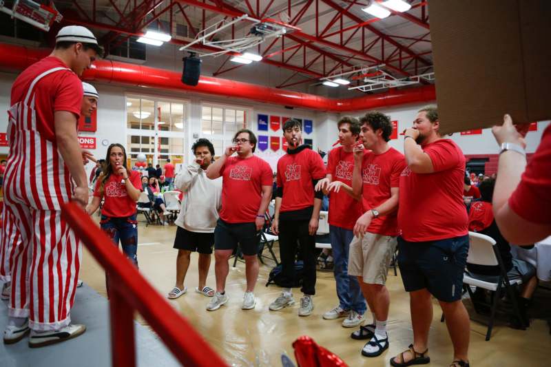 a group of people in red shirts
