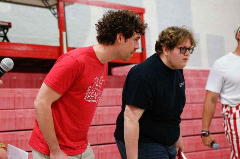two men walking in a gym