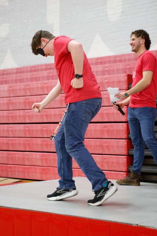 a man wearing a blindfold and dancing