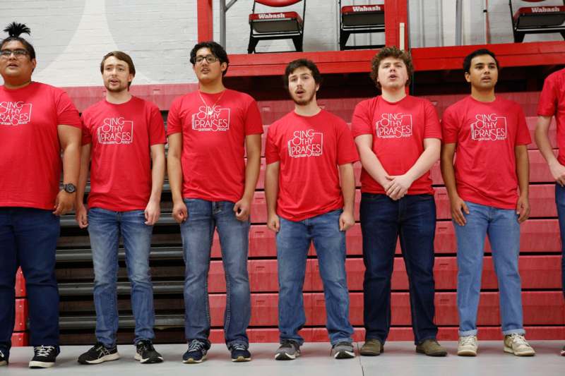 a group of men wearing red shirts