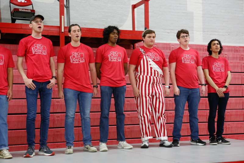 a group of men wearing red shirts