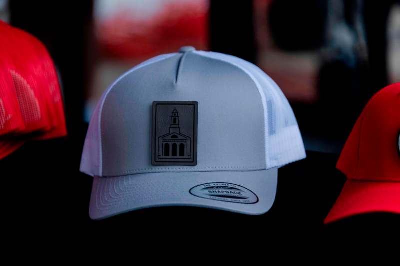 a white hat with a logo on it