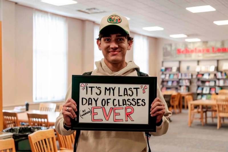 a man holding a sign