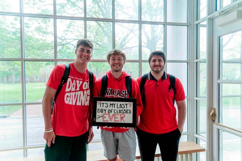 a group of men in red shirts