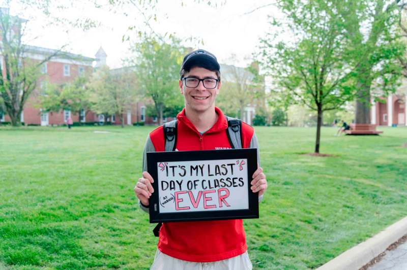 a man holding a sign