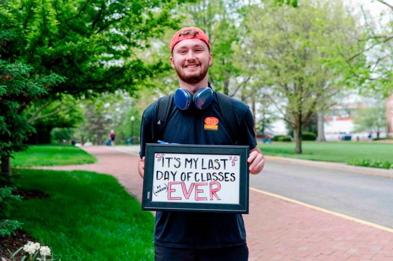 a man holding a sign