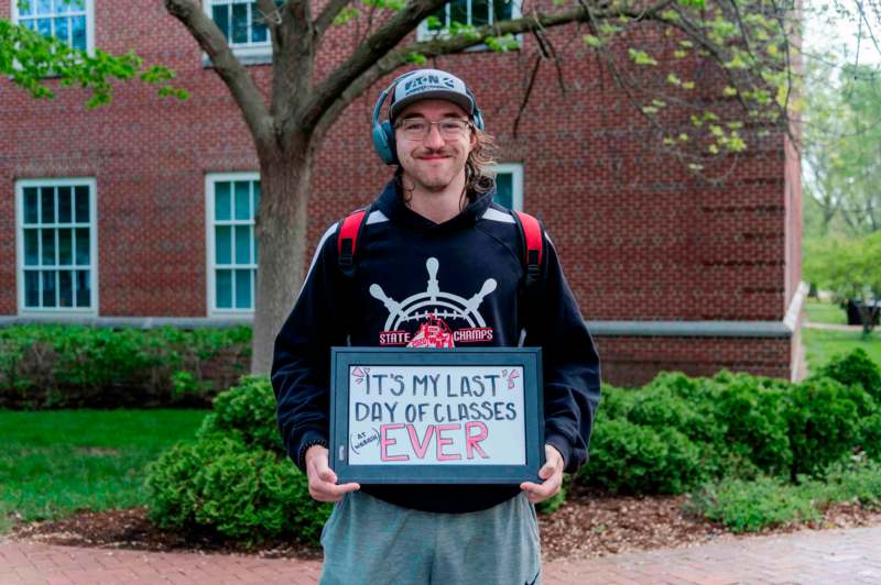 a man holding a sign