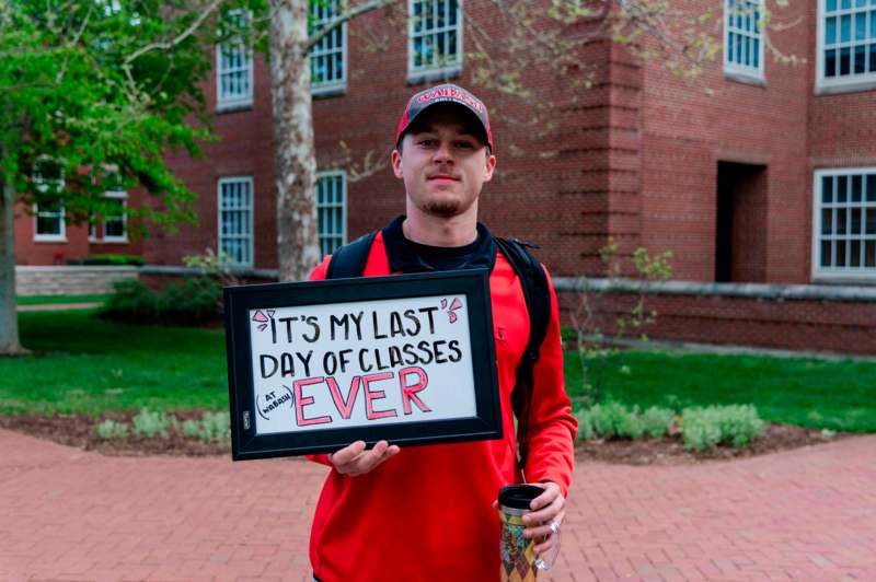 a man holding a sign