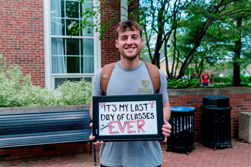 a man holding a sign