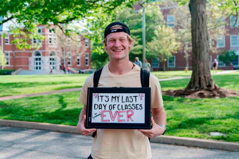 a man holding a sign