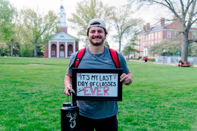 a man holding a sign