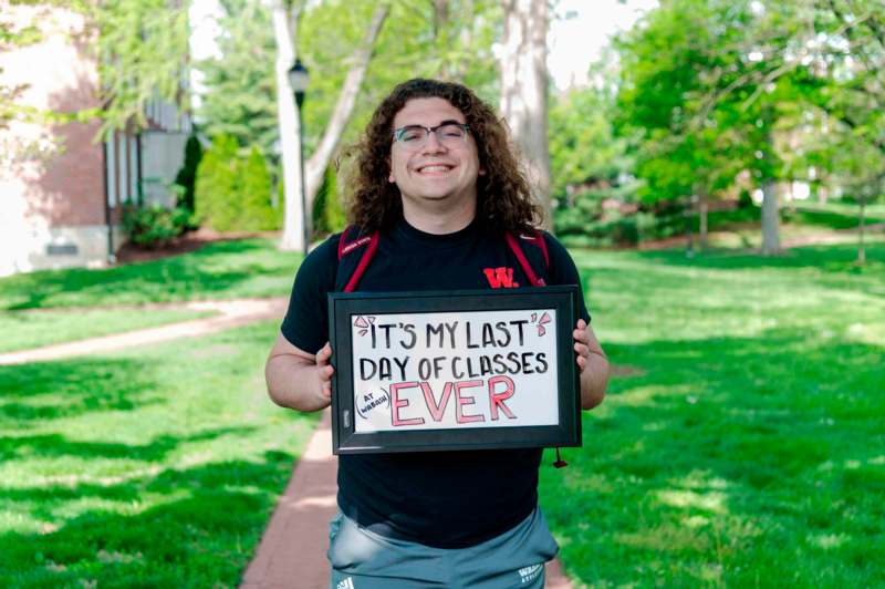 a man holding a sign