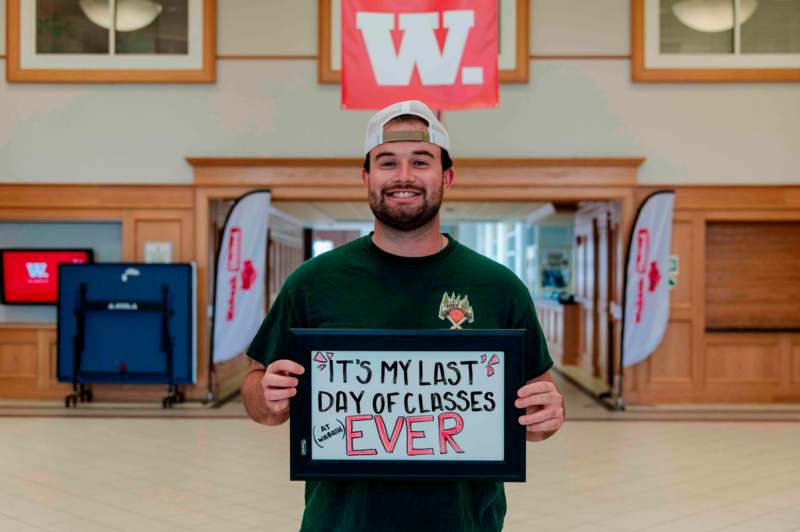 a man holding a sign