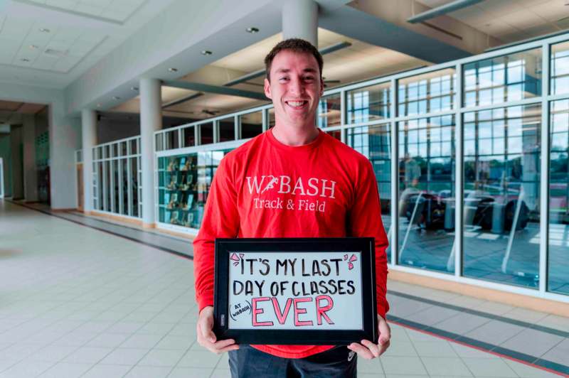 a man holding a sign
